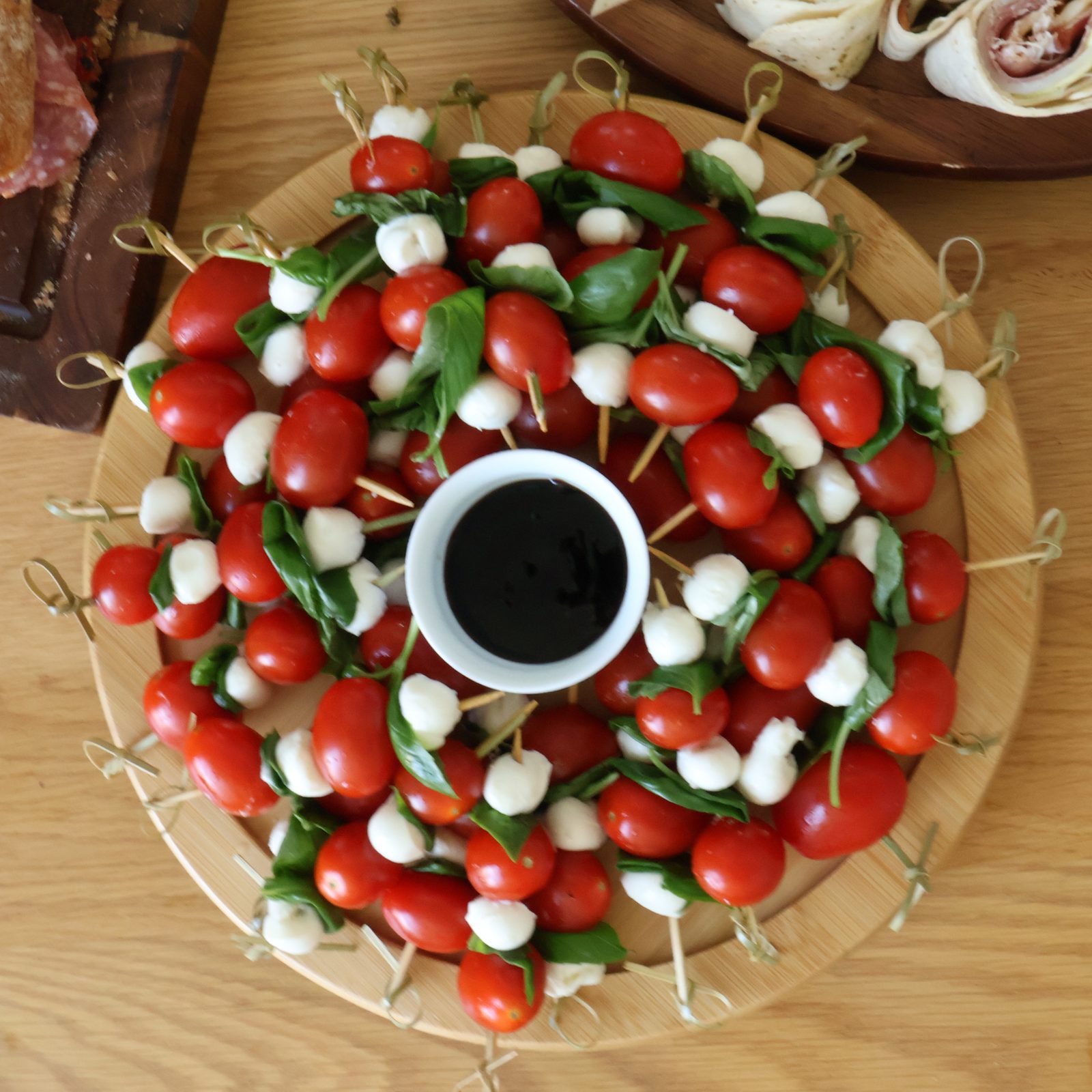 caprese skewers — cherry tomato, mozzarella pearl, basil, balsamic