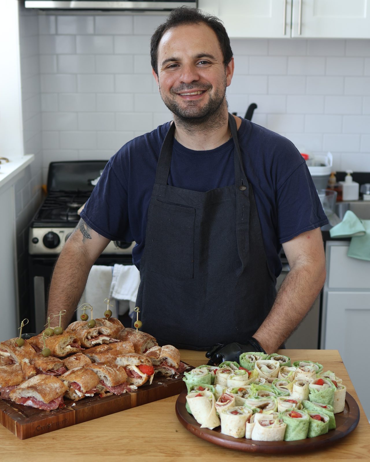 Nick Maldarelli behind the spread, in the kitchen
