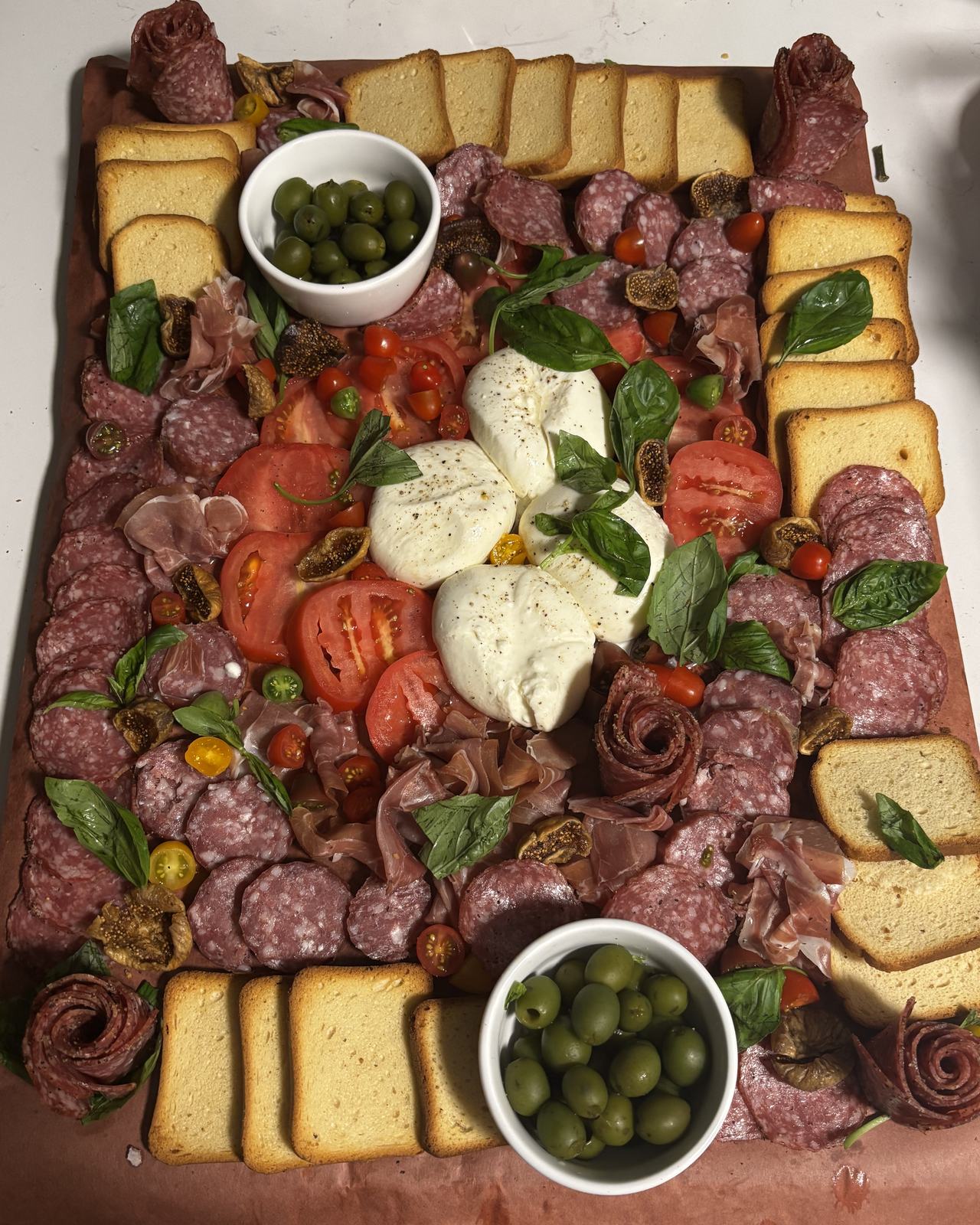 the salumi & burrata board — cured meats, burrata, tomatoes, figs, olives